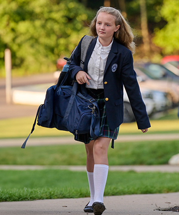 Student walking conidently to class